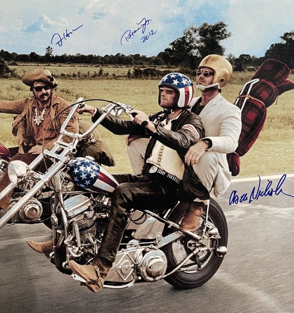 Three men riding motorcycles on a road.