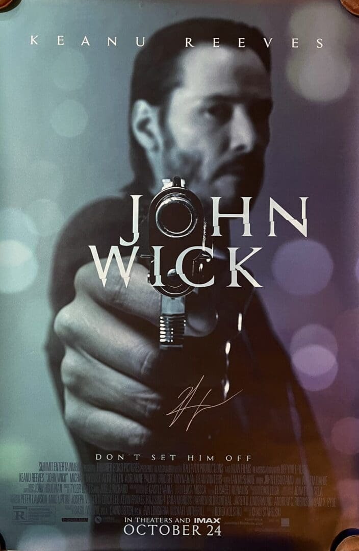 Movie poster featuring man aiming gun.