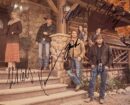 Group standing outside rustic