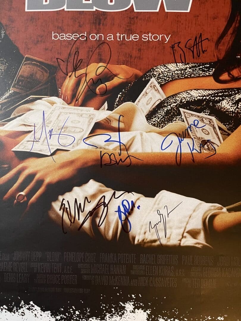 Movie poster with multiple signatures and money.