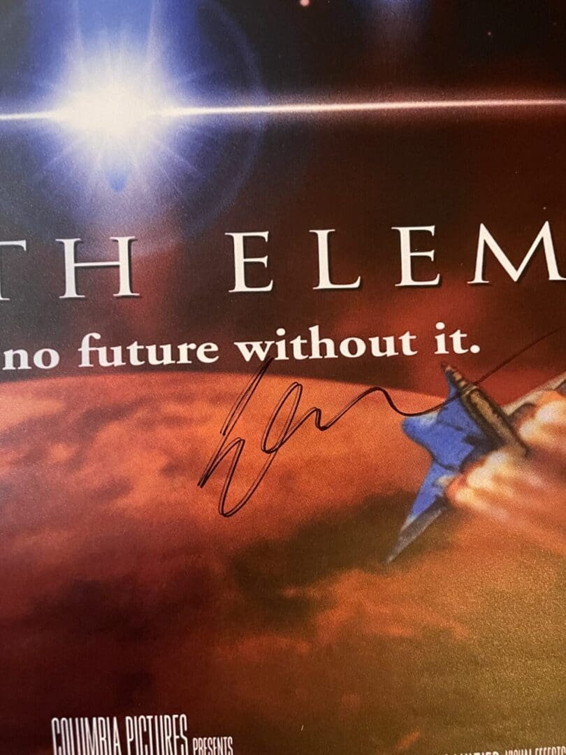 Signed movie poster with spaceship and text.