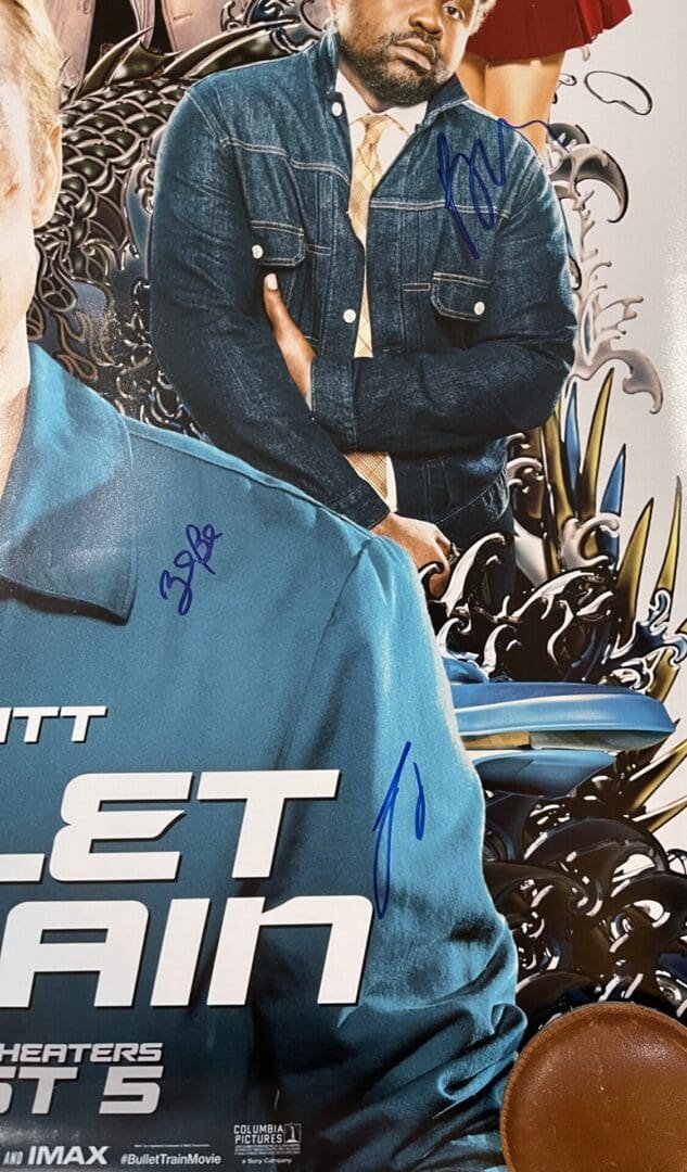Movie poster with autographs and denim jacket.