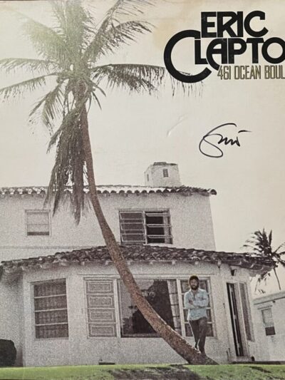 Album cover with house and palm tree.