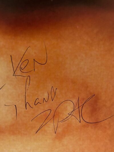Handwritten note on brownish background.