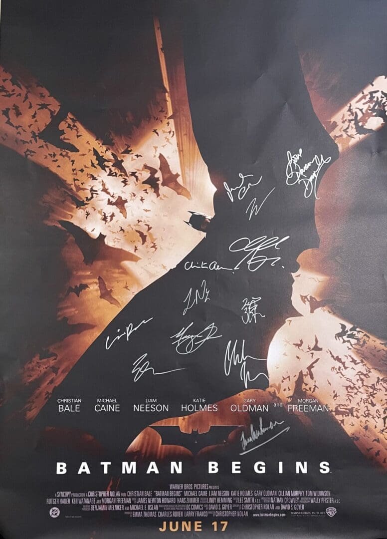 Batman Begins poster with multiple autographs.