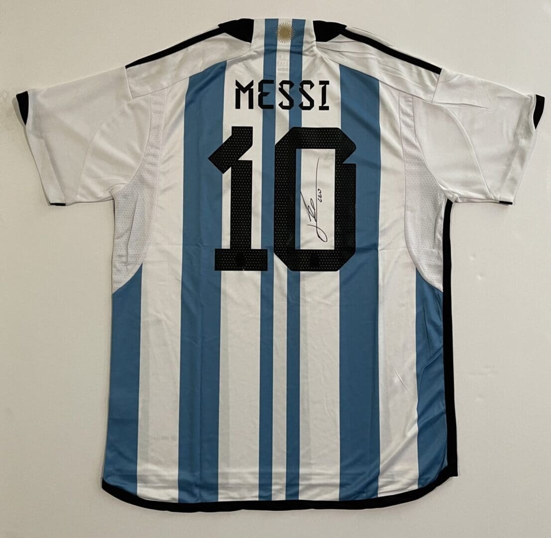 Striped jersey with "Messi" and number 10.