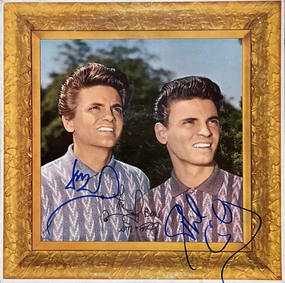 Two men smiling