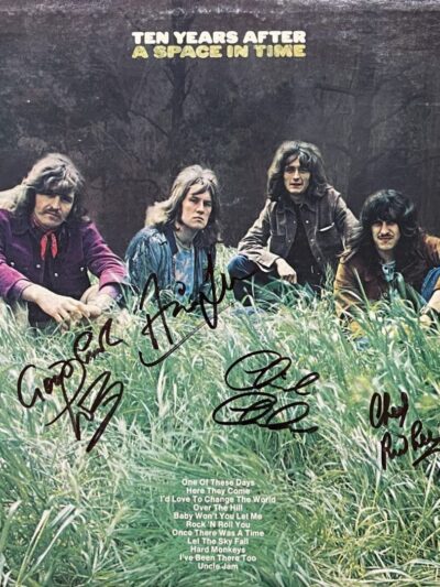 Band sitting in grass