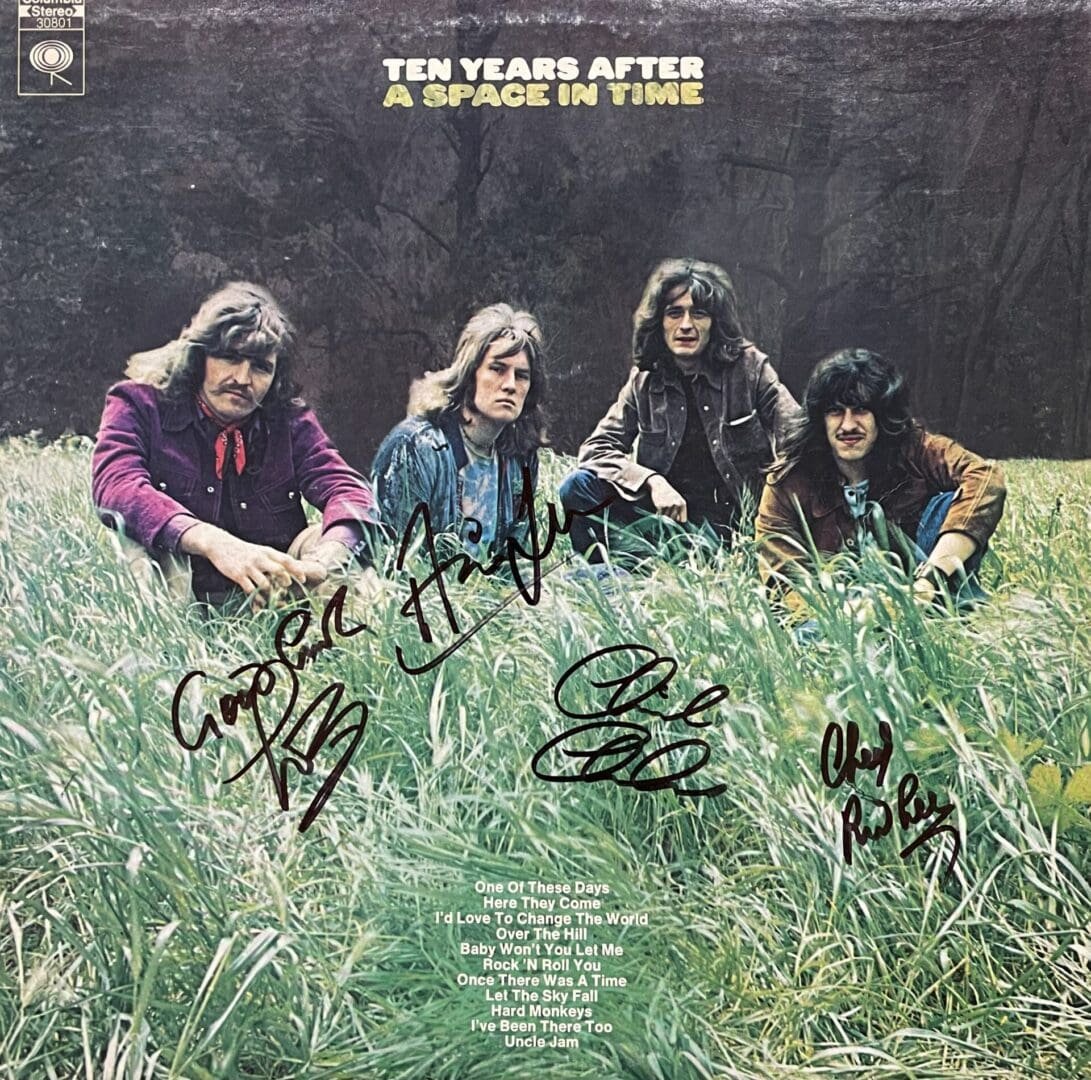 Band sitting in grass