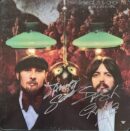 Signed album cover with two men.