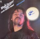 Album cover with person and bright light.
