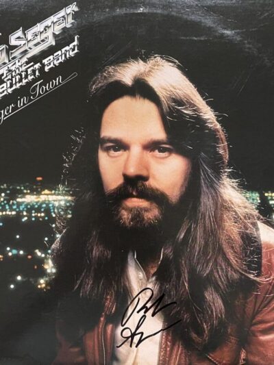 Album cover with long-haired man.