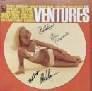 Album cover with woman in gold bikini.