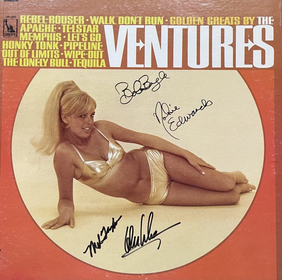 Album cover with woman in gold bikini.
