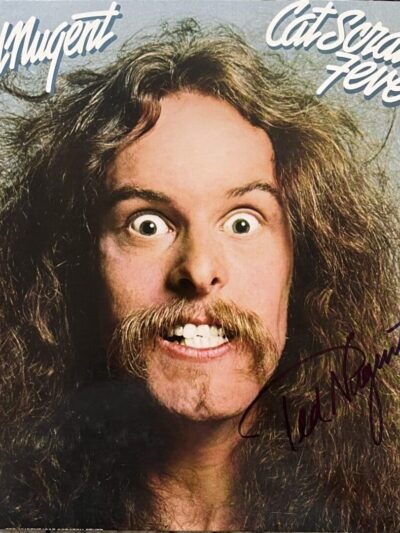 Man with wild hair and intense expression.