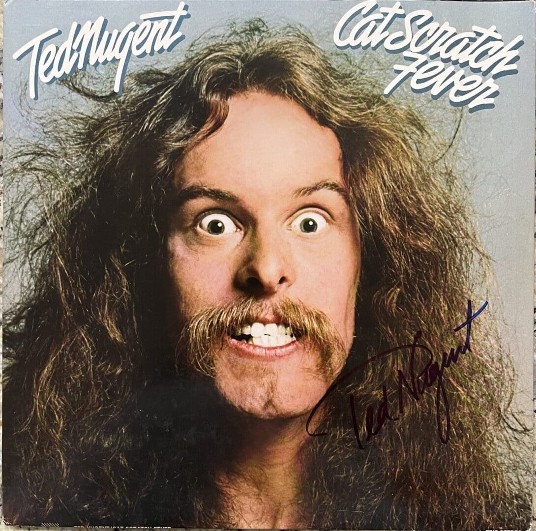 Man with wild hair and intense expression.