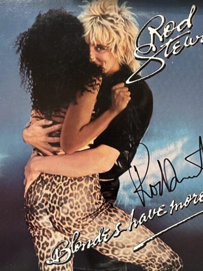 Blonde man embraces woman