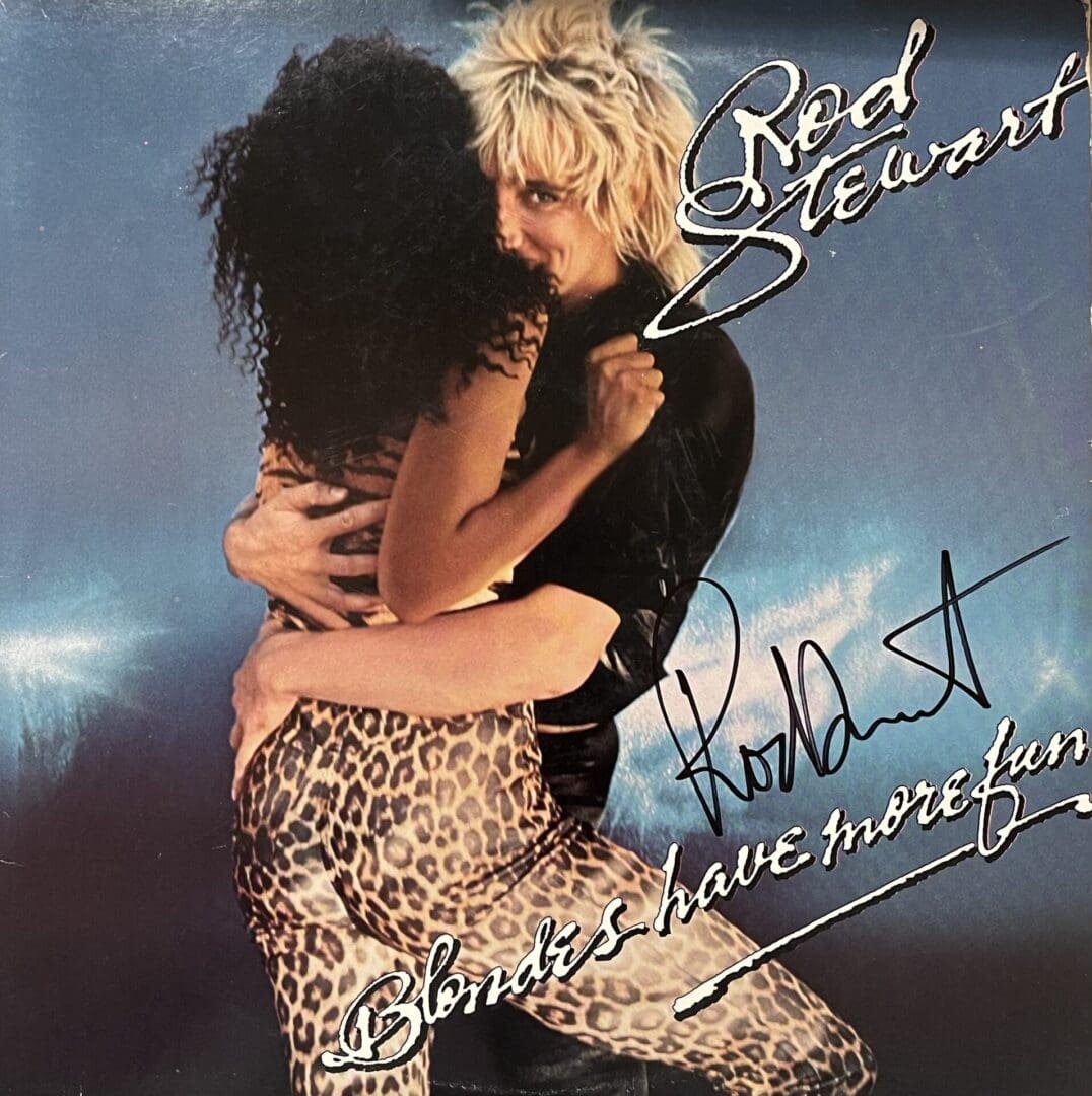 Blonde man embraces woman