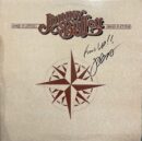 Album cover with compass and signature.
