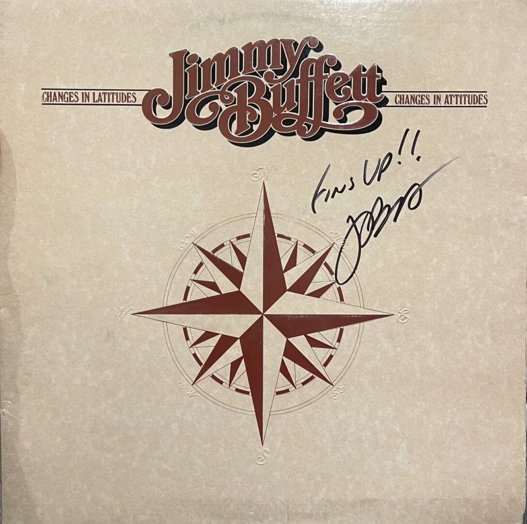 Album cover with compass and signature.