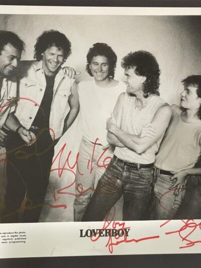 Five people posing in a black-and-white photo.