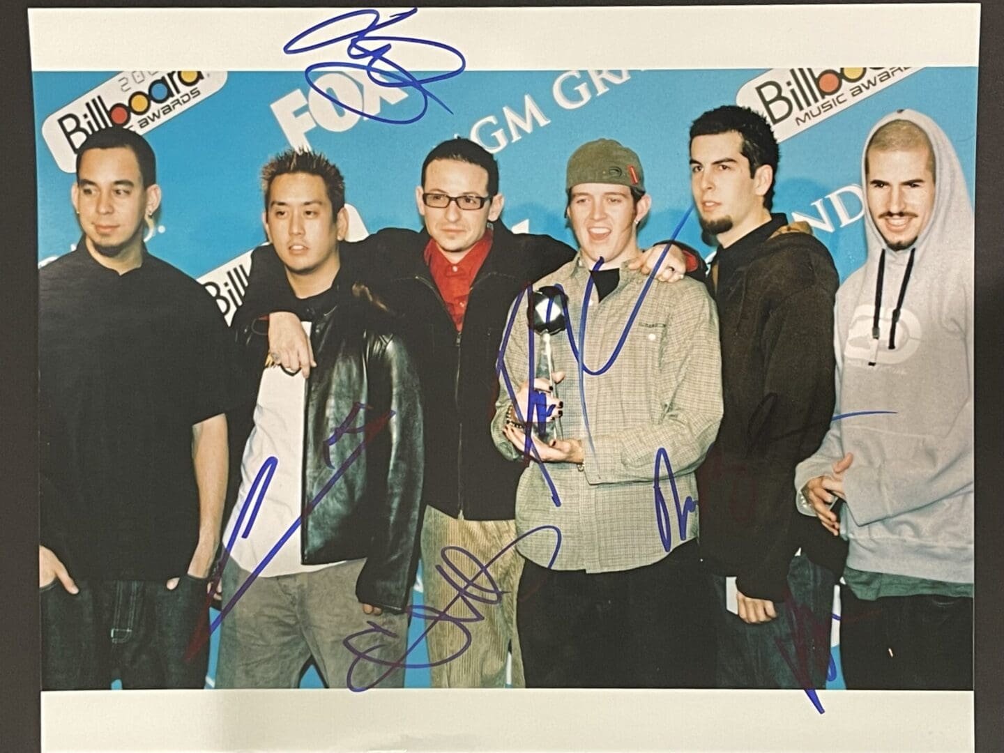 Group of six men at awards event.