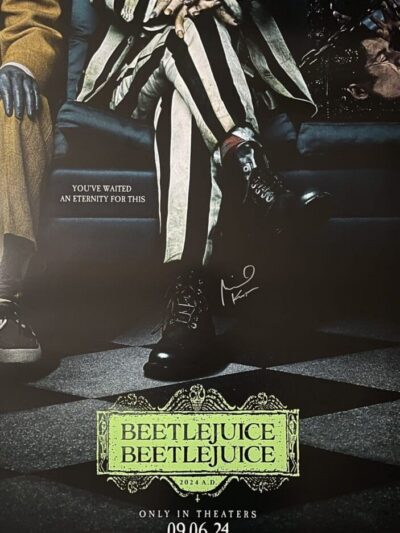 Beetlejuice movie poster with striped suit.