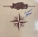 Album cover with compass and signature.
