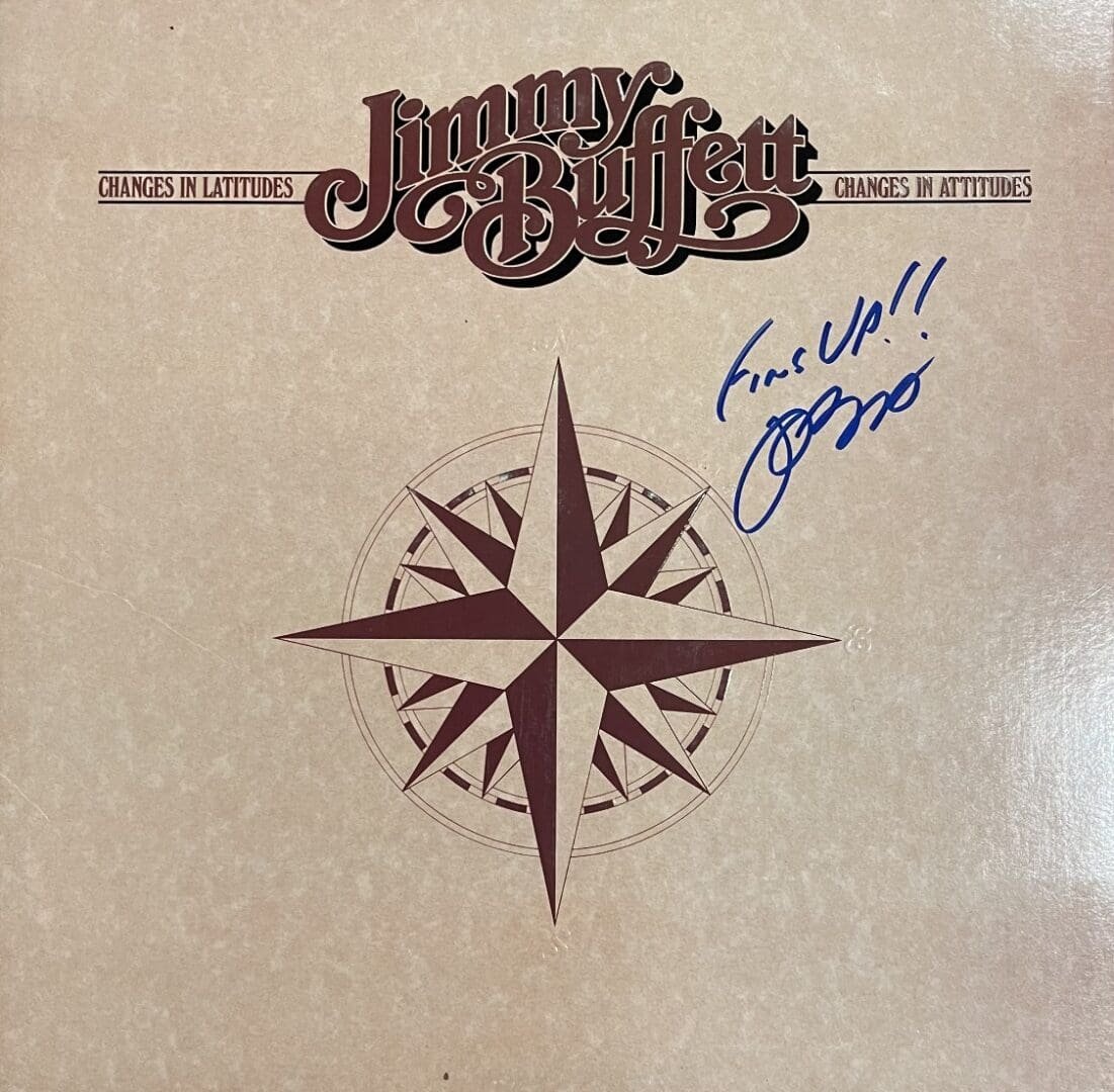 Album cover with compass and signature.