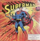 Superman breaking chains on comic book cover.
