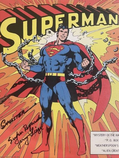 Superman breaking chains on comic book cover.