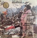 Woodstock album cover with signatures and crowd.