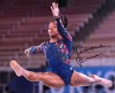 Gymnast performing a leap in competition.