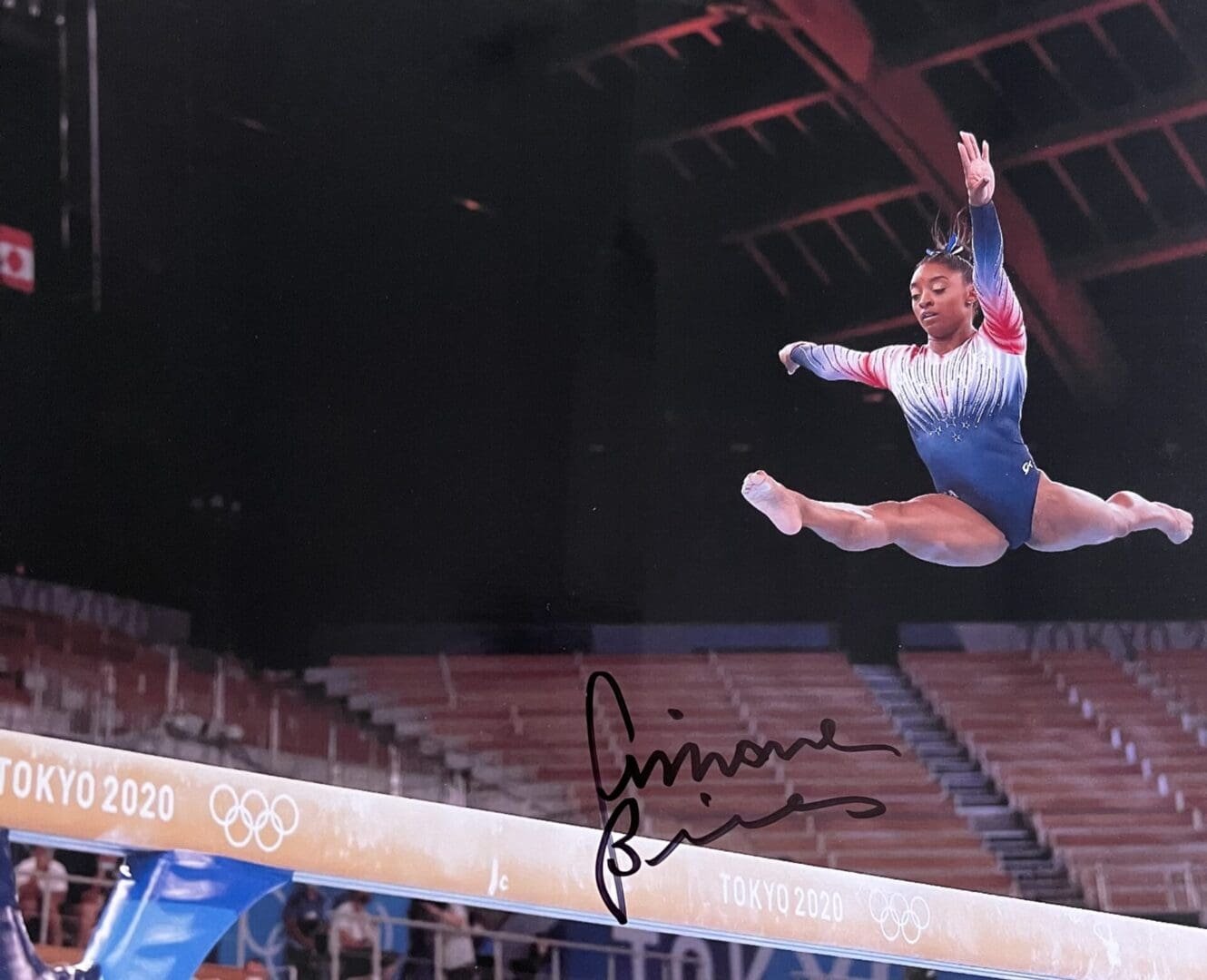 Gymnast performing on balance beam