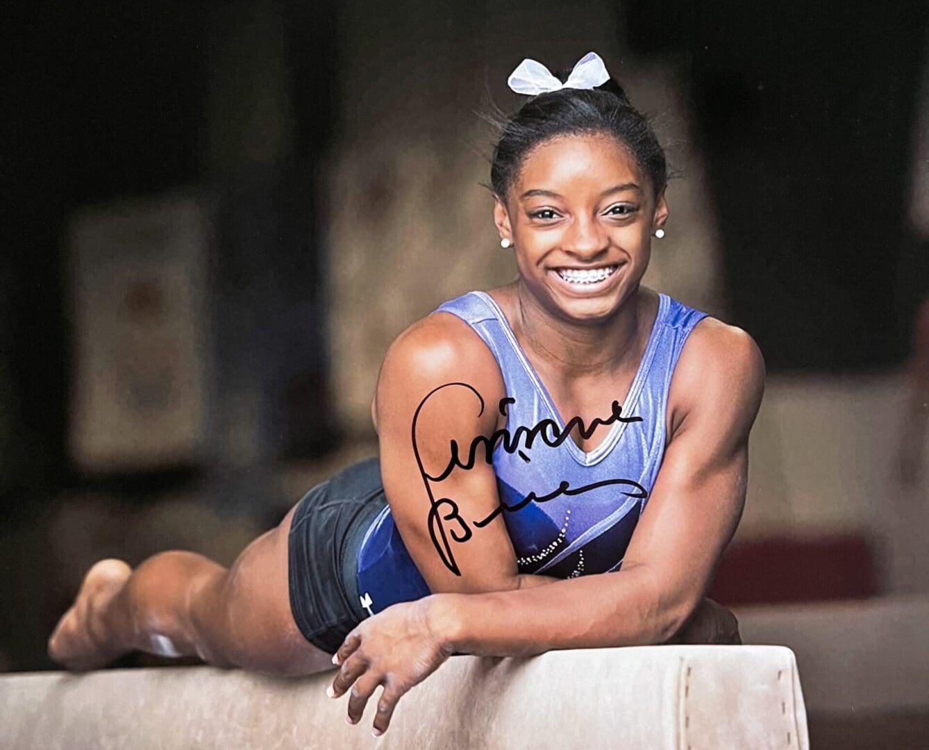 Athlete smiling on balance beam