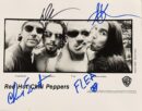 Black and white band photo with signatures.