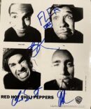 Black-and-white band photo with signatures.