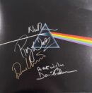 Prism with colorful light and signatures.