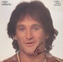 A person smiling on an album cover.