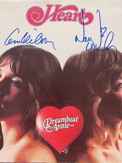 Album cover with two women and signatures.