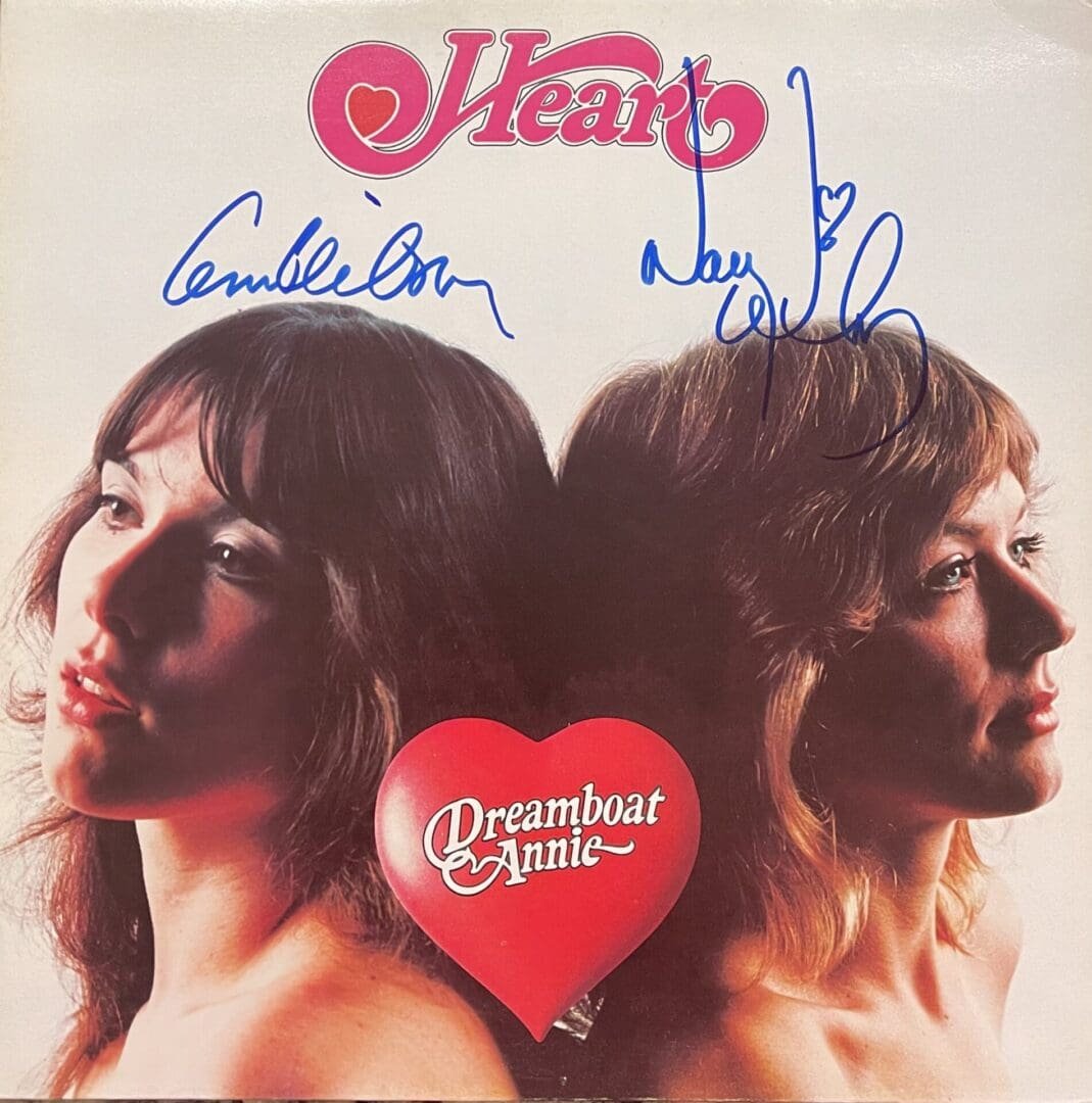 Album cover with two women and signatures.