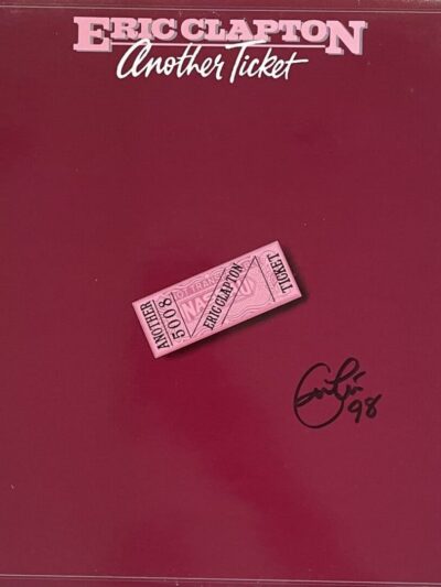 Album cover with ticket and signature.