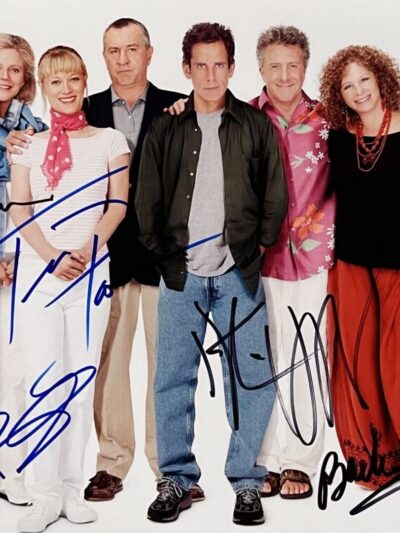 Group of six people standing together smiling.