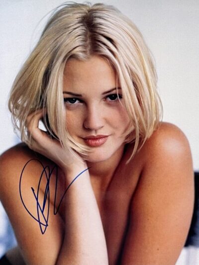 Young woman with short blonde hair smiling.