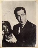 Man holding statuette