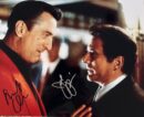 Two men conversing in a dramatic scene.