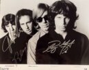 Four men in a black and white photo.