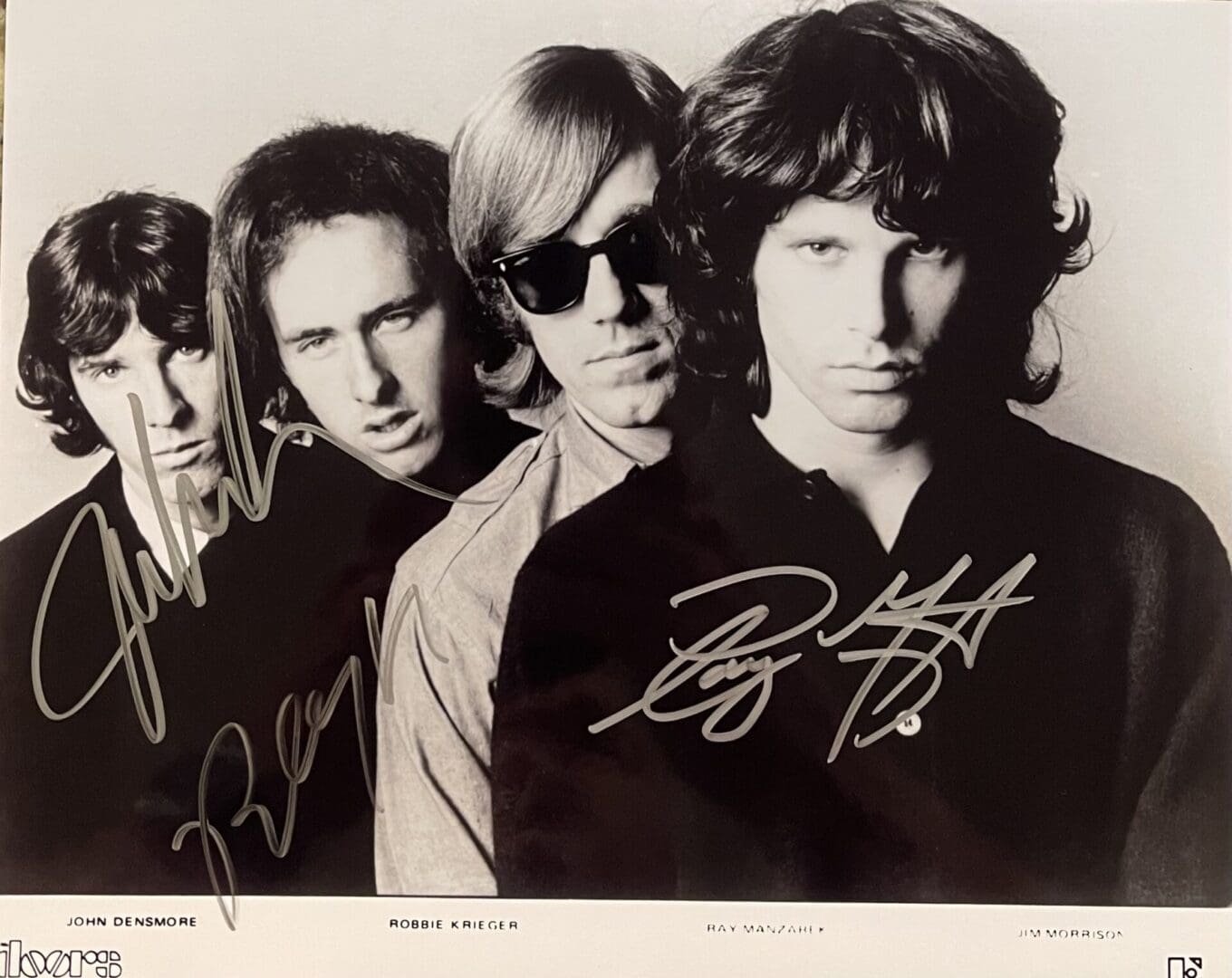 Four men in a black and white photo.