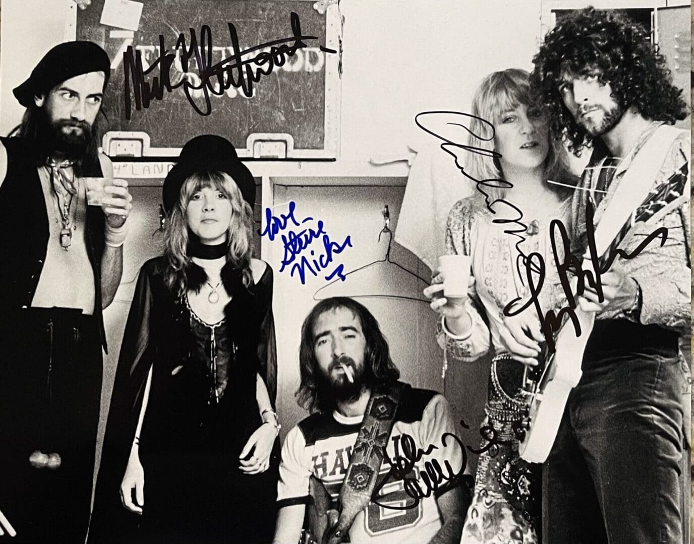 Band members posing with musical instruments.