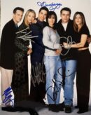 Group of six people posing together